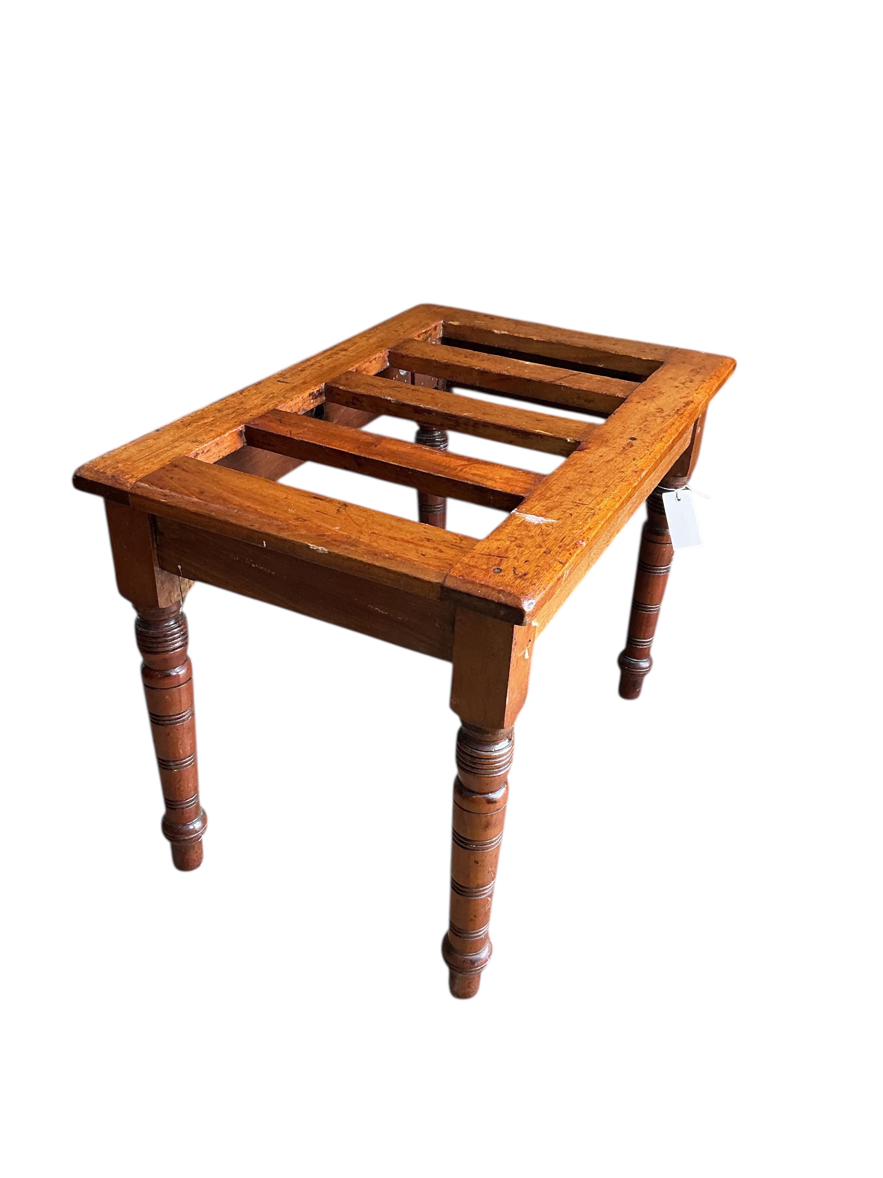A late Victorian mahogany luggage stand, width 61cm, depth 41cm, height 46cm